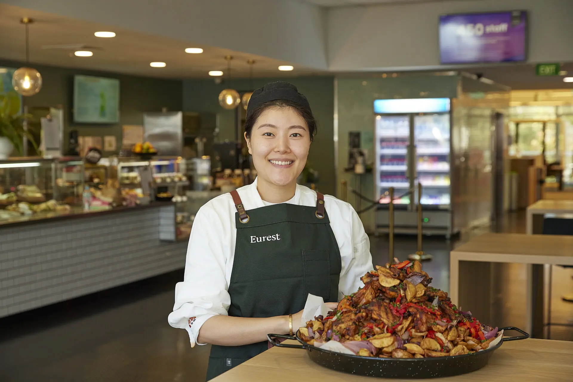 Eurest team member with a dish