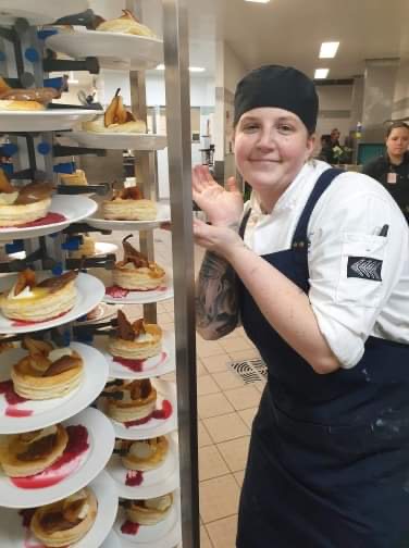 Sam Green next to her baked goods